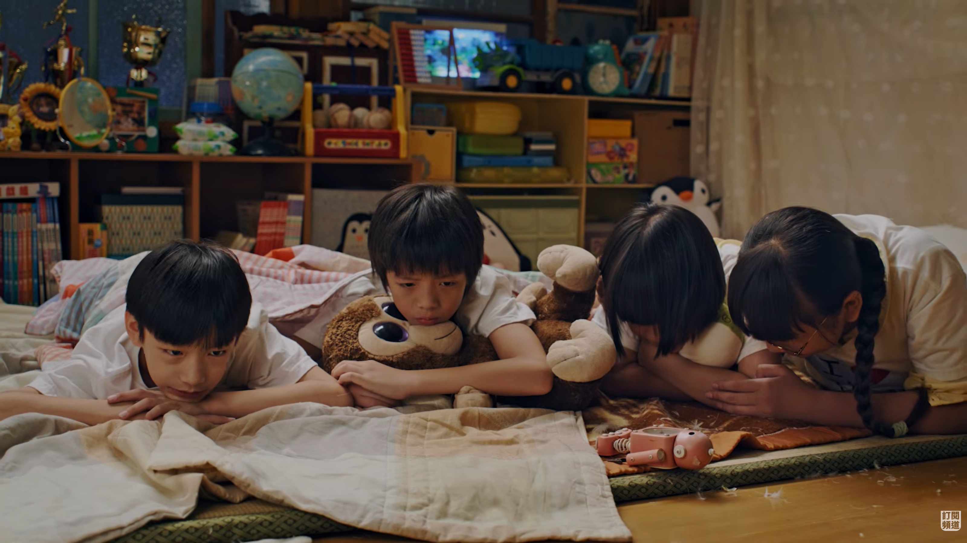 The four young protagonists of The Grocery Store of Nothing lying together in the store